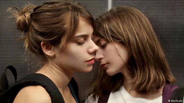 Daniela and Antonia stand very close together
