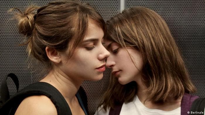 Daniela and Antonia stand very close together